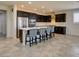 Modern kitchen with stainless steel appliances, granite countertops, and a spacious island at 1128 Via Della Curia, Henderson, NV 89011
