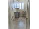 Well-organized laundry room features ample cabinet space and a utility sink, conveniently designed for efficiency at 1128 Via Della Curia, Henderson, NV 89011