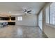 Bright living room featuring plantation shutters, tile flooring and recessed lighting at 1128 Via Della Curia, Henderson, NV 89011
