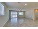 Open concept living space with tile floors, recessed lighting, and plantation shutters at 1128 Via Della Curia, Henderson, NV 89011