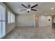 Spacious living room featuring tile floors, recessed lighting, and multiple doorways for easy access at 1128 Via Della Curia, Henderson, NV 89011