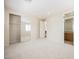 Spacious bedroom featuring carpeted floors, closet, and access to a bathroom at 11534 Glowing Sunset Ln, Las Vegas, NV 89135