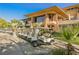 Elegant clubhouse exterior with golf carts parked nearby, showcasing a luxurious lifestyle and amenities at 11534 Glowing Sunset Ln, Las Vegas, NV 89135
