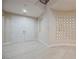 Bright foyer with white tile flooring, double doors, decorative mirrored wall art, and an open staircase at 11534 Glowing Sunset Ln, Las Vegas, NV 89135
