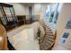 Grand foyer showcasing a winding staircase, chandelier, and large windows offering abundant natural light and outdoor views at 11534 Glowing Sunset Ln, Las Vegas, NV 89135