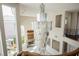 Stunning foyer with soaring ceilings, a grand crystal chandelier, and an open view of the staircase and living area at 11534 Glowing Sunset Ln, Las Vegas, NV 89135
