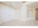 Bright foyer features tile flooring, double doors, decorative mirrored wall art, and an open staircase at 11534 Glowing Sunset Ln, Las Vegas, NV 89135