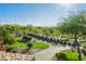 Rows of golf carts sit on a paved lot amidst lush greenery and desert landscaping at 11534 Glowing Sunset Ln, Las Vegas, NV 89135