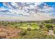 Picturesque golf course view featuring lush green fairways, manicured sand traps, and scenic desert landscape at 11534 Glowing Sunset Ln, Las Vegas, NV 89135