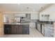 Modern kitchen featuring stainless steel appliances, granite counters, and an oversized island at 11534 Glowing Sunset Ln, Las Vegas, NV 89135