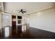 Spacious living room features dark wood floors, fireplace, built-in cabinets, and access to the patio at 11534 Glowing Sunset Ln, Las Vegas, NV 89135
