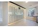 Modern wine cellar boasting glass enclosure, efficient racking system, and temperature control for optimal storage at 11534 Glowing Sunset Ln, Las Vegas, NV 89135