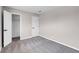 Neutral bedroom with grey carpet, white trim, baseboards, and a walk-in closet offers a bright, adaptable space at 1189 Blankenship Ave, Las Vegas, NV 89106