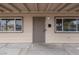 Close-up of front door with security bars on windows and a covered entrance at 1189 Blankenship Ave, Las Vegas, NV 89106