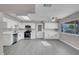 Bright kitchen featuring stainless steel appliances, white cabinets, and modern countertops at 1189 Blankenship Ave, Las Vegas, NV 89106