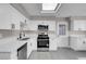 Beautiful kitchen featuring white cabinets, stainless steel appliances, and a skylight at 1189 Blankenship Ave, Las Vegas, NV 89106