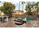 This is a backyard with a raised pool and spa, with lots of mature trees for privacy at 1350 Rossini St, Henderson, NV 89052