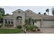 Charming single-story home with a well-manicured front yard and a three-car garage at 1350 Rossini St, Henderson, NV 89052