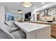 Modern open kitchen with large island, bar seating, and views into the living area and backyard at 1350 Rossini St, Henderson, NV 89052