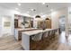 Modern kitchen with island seating, stylish lighting, and stainless steel appliances at 1350 Rossini St, Henderson, NV 89052