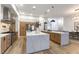 Bright, modern kitchen with white marble counters, a large island, and stainless steel appliances at 1350 Rossini St, Henderson, NV 89052