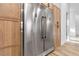 Close up of stainless steel refrigerator and wooden cabinets in kitchen at 1350 Rossini St, Henderson, NV 89052