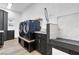 Beautiful laundry room features tile floors, a dog washing station and modern appliances at 1350 Rossini St, Henderson, NV 89052