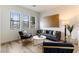 Cozy living room with modern furniture, large windows, and stylish decor, creating a comfortable atmosphere at 1350 Rossini St, Henderson, NV 89052