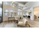 Open living room featuring high ceilings, large windows, and stylish furniture at 1350 Rossini St, Henderson, NV 89052