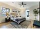 Cozy bedroom with large window, ceiling fan, and ensuite bathroom at 1350 Rossini St, Henderson, NV 89052