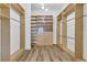 Spacious walk-in closet with custom built-in shelving and drawers for optimal organization at 1350 Rossini St, Henderson, NV 89052