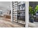 Stylish wine cellar with glass enclosure, bar area, and kitchen, ideal for entertaining and showcasing your collection at 1350 Rossini St, Henderson, NV 89052