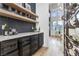 Elegant wine room featuring custom shelves, storage, and a bar area, perfect for wine enthusiasts at 1350 Rossini St, Henderson, NV 89052