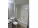 Bathroom with a granite sink and bathtub with white tiling at 1447 Hialeah Dr # B, Las Vegas, NV 89119