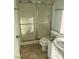 Bathroom featuring walk-in shower and granite sink at 1447 Hialeah Dr # B, Las Vegas, NV 89119
