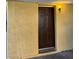 A close up of the front door with 'B' on it, with a light shining above the door at 1447 Hialeah Dr # B, Las Vegas, NV 89119