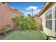 Cozy backyard with low-maintenance landscaping and artificial grass at 1453 Blisworth Ct # 102, Las Vegas, NV 89102