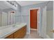 Bathroom with a white tile countertop, wood cabinets, and a shower with a curtain at 1453 Blisworth Ct # 102, Las Vegas, NV 89102