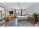 Spacious bedroom featuring hardwood floors, neutral walls, and a stylish area rug at 1453 Blisworth Ct # 102, Las Vegas, NV 89102