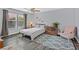 Bright bedroom with a ceiling fan, hardwood floors, and ample natural light from the windows at 1453 Blisworth Ct # 102, Las Vegas, NV 89102