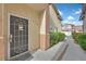 Charming home entrance features a secure storm door and well-maintained walkway at 1453 Blisworth Ct # 102, Las Vegas, NV 89102