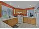 Functional kitchen features ample cabinet space, bright lighting, and tile countertops at 1453 Blisworth Ct # 102, Las Vegas, NV 89102
