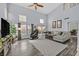 Bright living room boasts soaring ceilings, large windows, and hardwood floors at 1453 Blisworth Ct # 102, Las Vegas, NV 89102