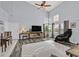 Open living area features hardwood floors, large windows, and access to dining area at 1453 Blisworth Ct # 102, Las Vegas, NV 89102