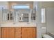 Bathroom featuring double sinks, vanity, walk-in closet access and combination bathtub/shower at 1531 Evening Spirit Ave, Las Vegas, NV 89183
