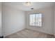 Bedroom featuring neutral carpet and window overlooking the neighborhood at 1531 Evening Spirit Ave, Las Vegas, NV 89183