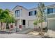Attractive two-story home boasts a balcony, attached garage, and well-maintained landscaping, exuding curb appeal and inviting charm at 1531 Evening Spirit Ave, Las Vegas, NV 89183