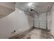 Clean, empty garage with a functional door and lighting, ready for storage or parking at 1531 Evening Spirit Ave, Las Vegas, NV 89183