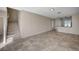 Open-concept living space with tile floors, staircase, and breakfast bar, perfect for modern living and entertaining guests at 1531 Evening Spirit Ave, Las Vegas, NV 89183