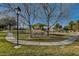 Picturesque park scene with winding paths, mature trees, and picnic areas for community enjoyment at 1531 Evening Spirit Ave, Las Vegas, NV 89183